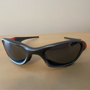 Oakley men’s sport sunglasses.  Black with red trim. Barely worn.